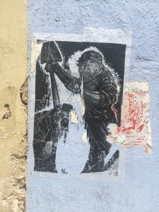 Instance of violence wheat-pasted on a wall
