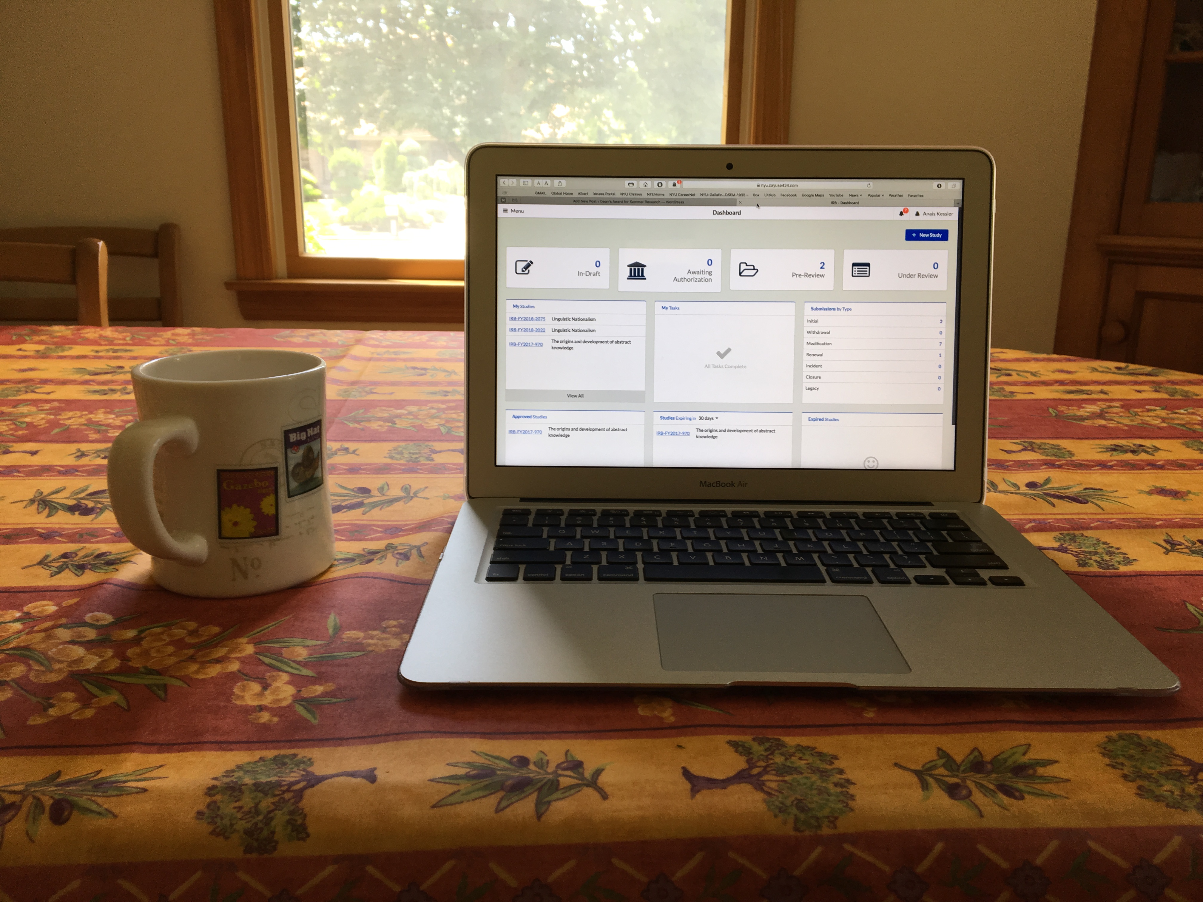 laptop and mug on table