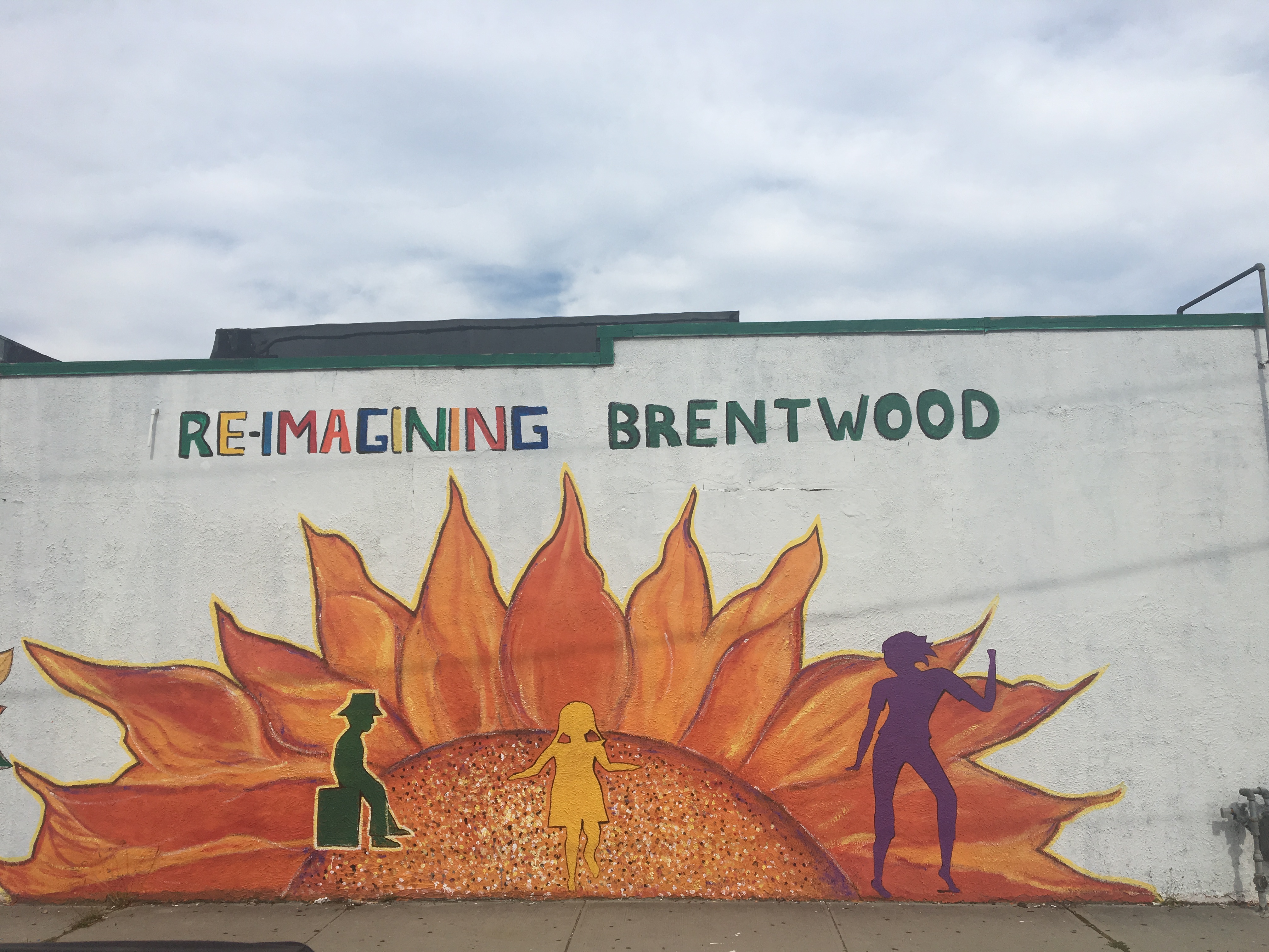 mural with sun, trees, people, and "Re-imagining Brentwood"