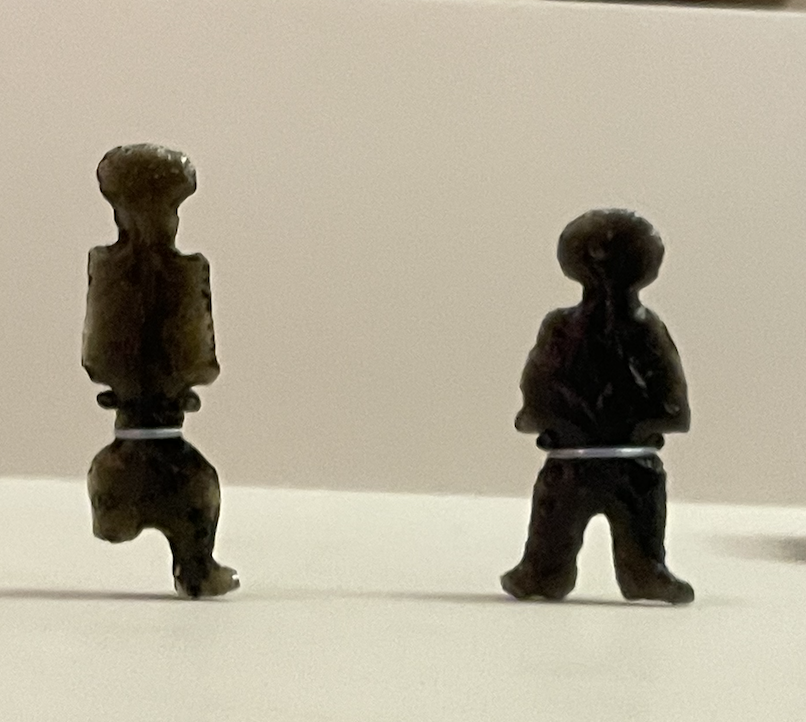 Two small obsidian shaped figurines